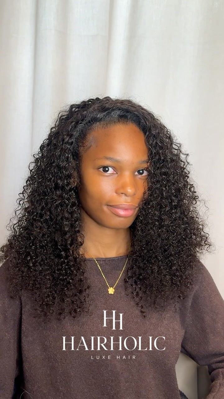 Client wearing 2 deep curly bundles in 18 inch, flip over sew-in