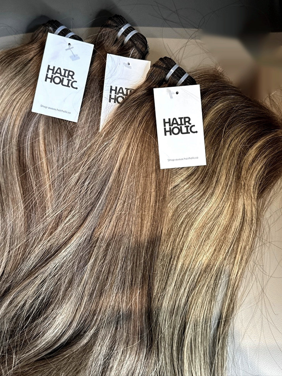 Vietnamese raw pre-colored hair bundles in Toasted Blonde with Hairholic tags